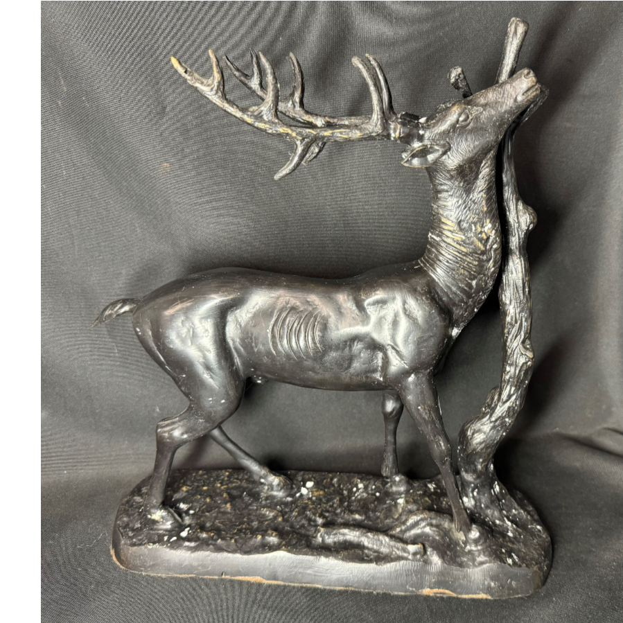 A magnificent black patina metal stag stretching to a tree branch - VIN1068M