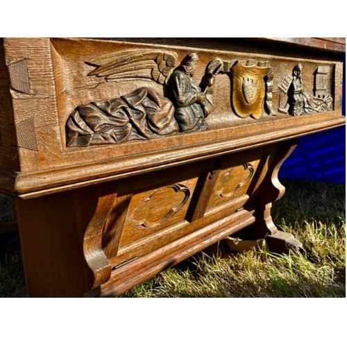 Circa 1850 oak table Fabulous carvings to feet and base, with swivel opening table top to double the size and front drop down door for storage.